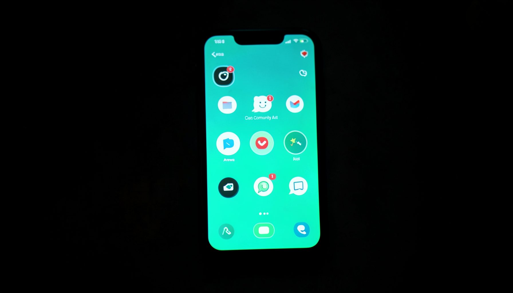 A smartphone screen glowing teal in a dark room, displaying social media icons, symbolising Arewa digital culture and online community